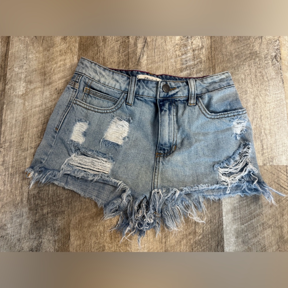 Cello ~ size 0 jean shorts, distressed throughout front